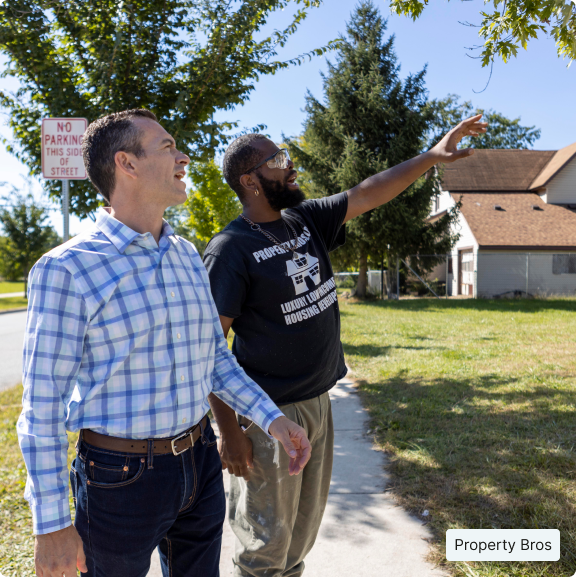 PROPERTY BROS – TWO MEN LOOKING AT HOMES, ONE IS POINTING